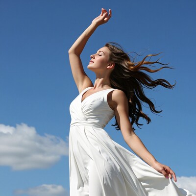 Woman dancing in white dress