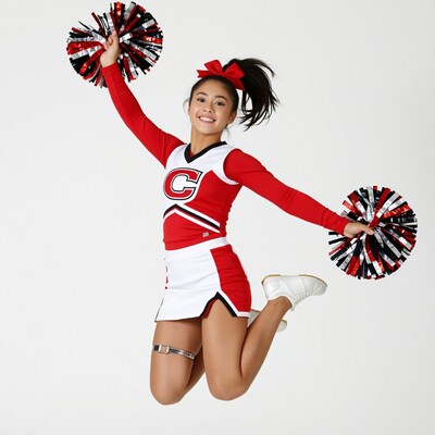Cheerleader jumping with pom poms
