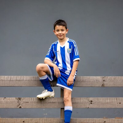 Young boy in blue soccer uniform