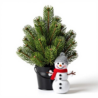 Knitted snowman with potted Christmas tree