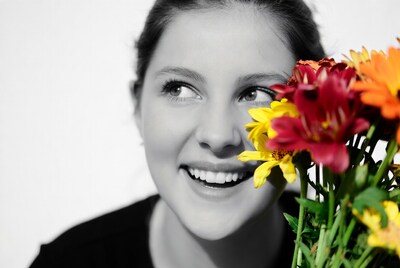 Smiling Woman with Colorful Flowers